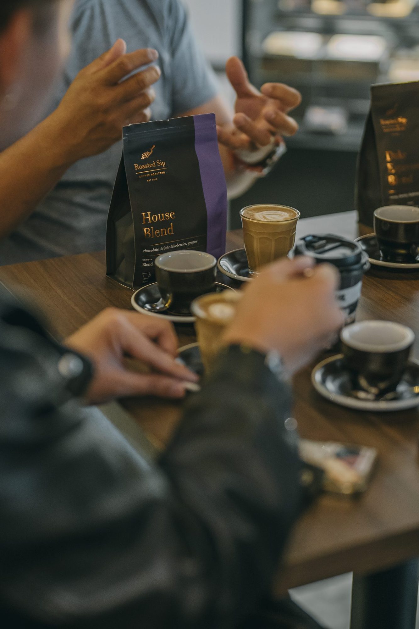 A wholesale client cupping Roasted Sip coffee at the roastery