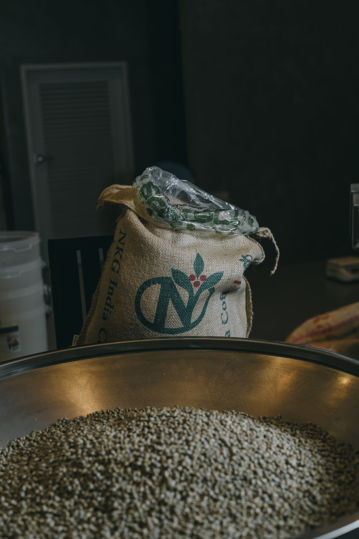 Green coffee being weighed at the Roasted Sip roastery