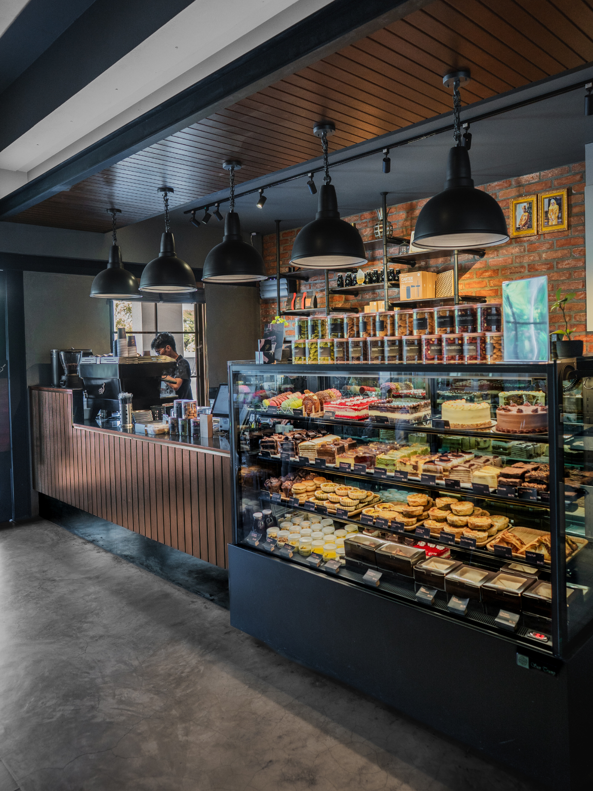 Roasted Sip Kiulap — the espresso bar, pendant lights and pastry case