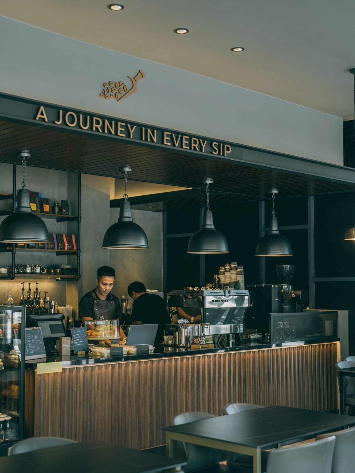 Roasted Sip Seria — the espresso bar, cake counter and ‘A Journey in Every Sip’ signage